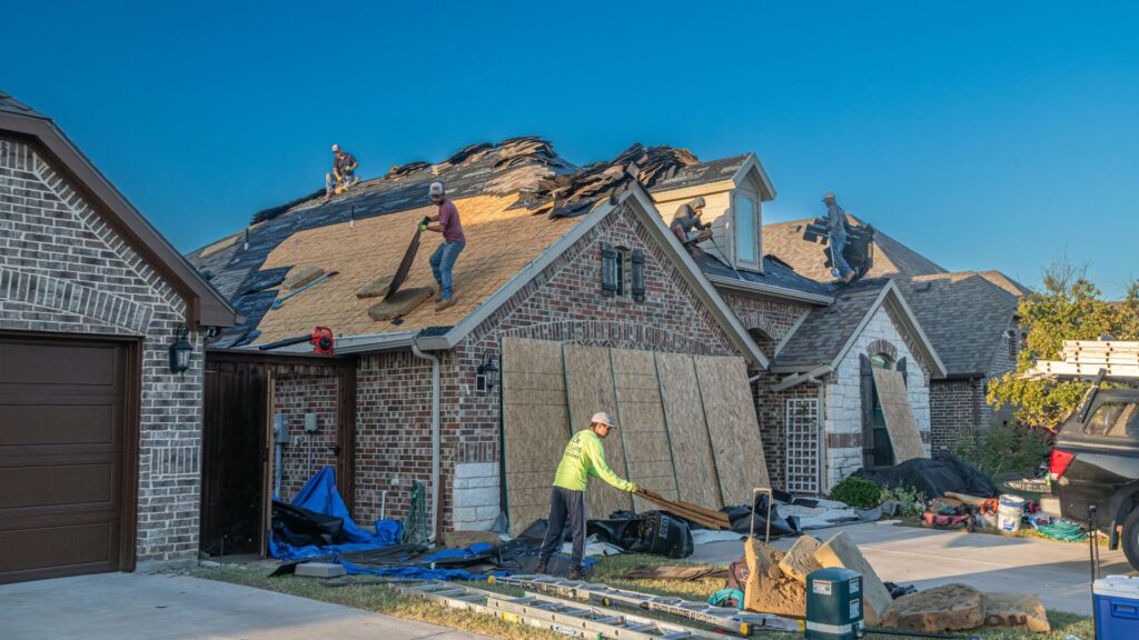 Roofing work in progress on house